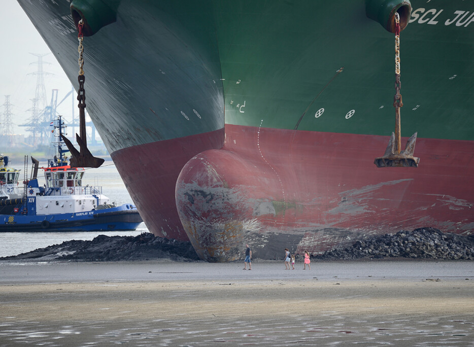 Salvage ISU Photograph Competition 2017, winning entry: Giant containership CSCL Jupiter grounded in the River Scheldt, later re-floated by Multraship Towage and Salvage. Photo credits: Chris Platteeuw. 